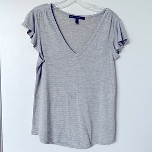 Gray and gold stripe flutter sleeve T-shirt.